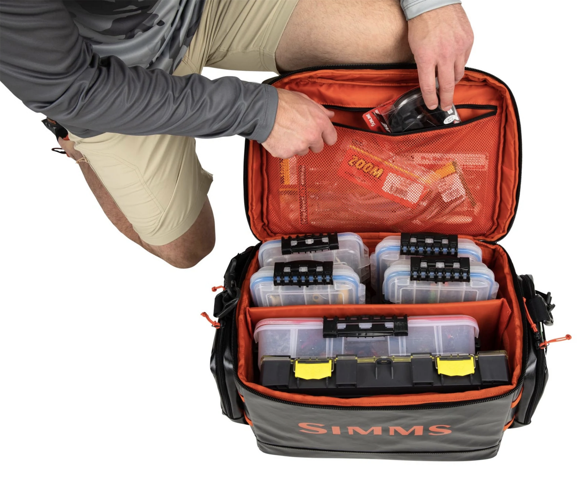 Simms Stash Bag with zippered mesh pocket under the lid, ideal for secure tackle storage.