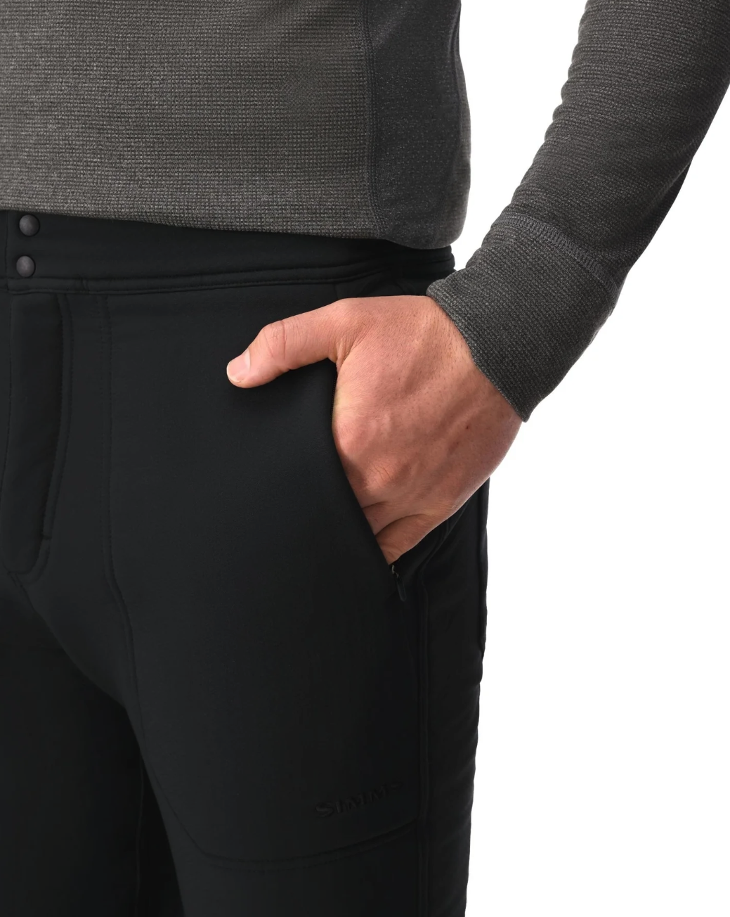Hand in front pocket of Simms Strata 330 Midlayer Bottoms