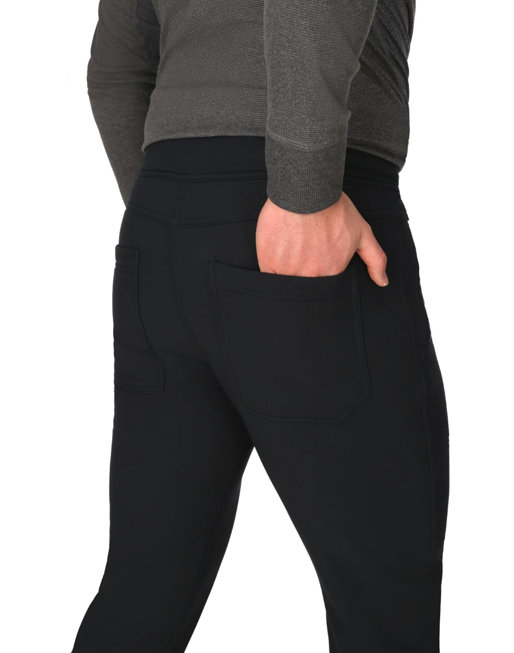 Hand in back pocket of Simms Strata 330 Midlayer Bottoms