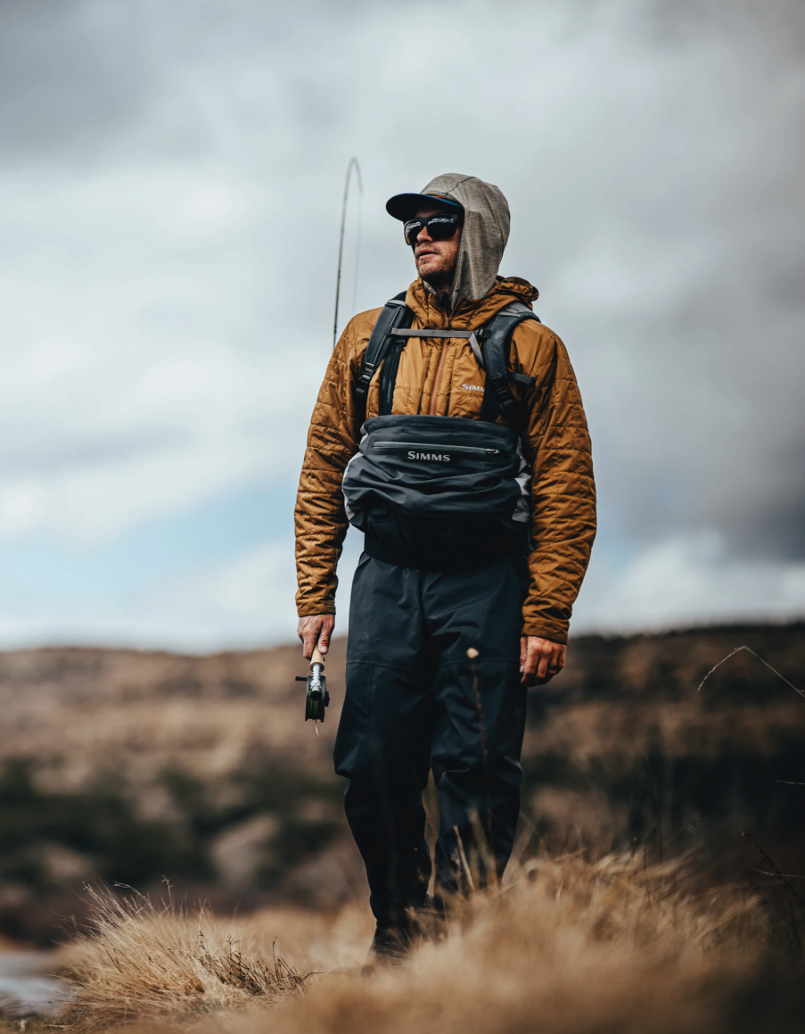 Angler wearing Simms Flyweight Packable Waders