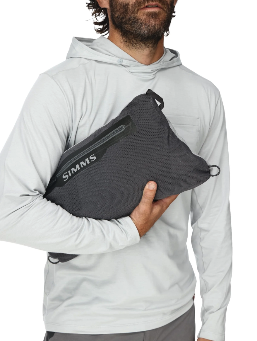 Simms Flyweight Packable Waders packed and held by man