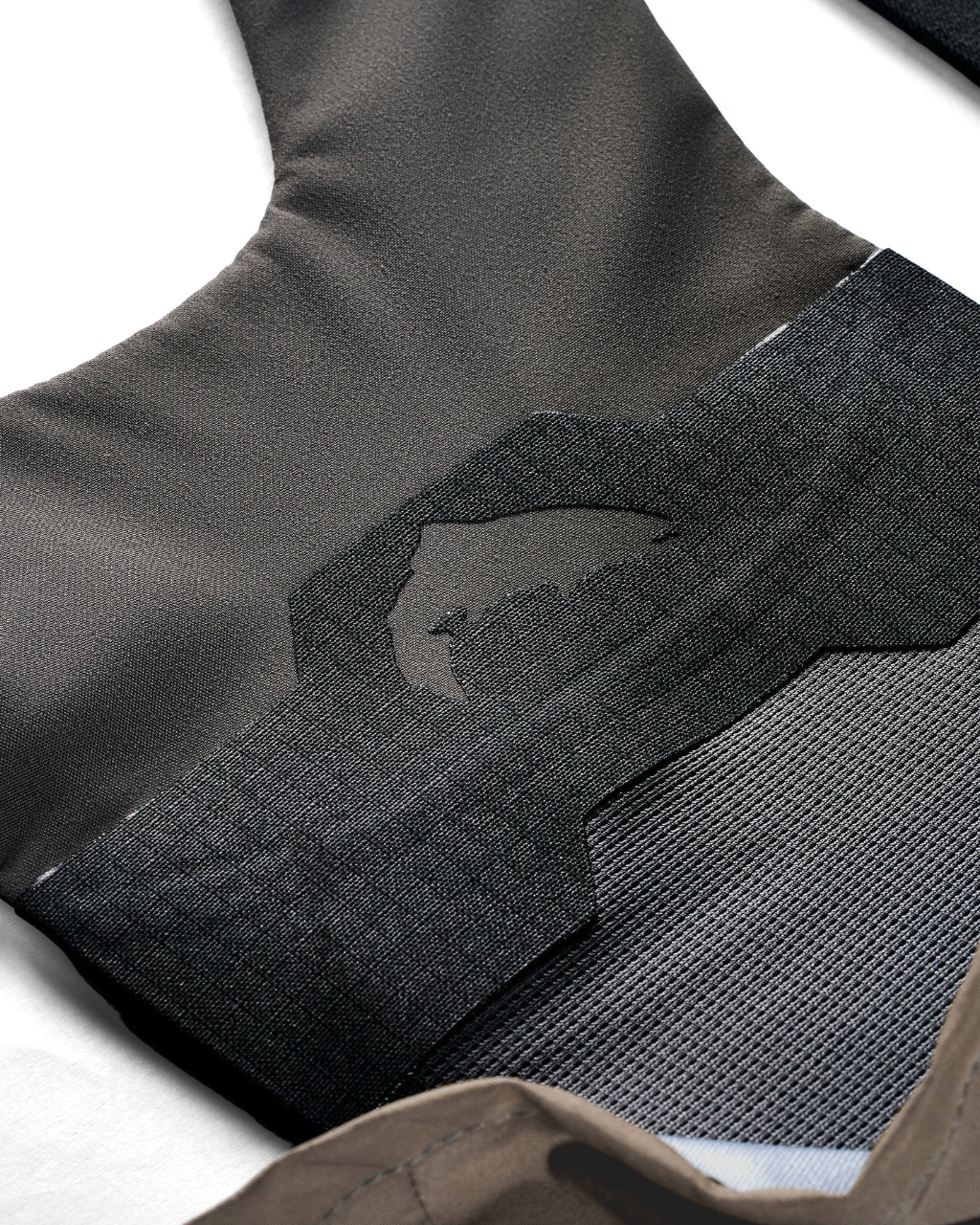 Close-up of Simms G3Z Pro Guide wader suspension system showing reinforced mesh fabric and Simms logo
