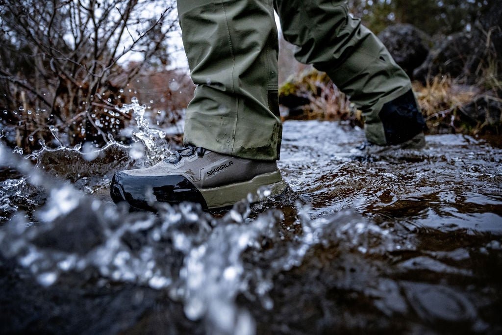 Skwala Carbon Wading Boots in river water showing wet traction performance for fly fishing and wading stability