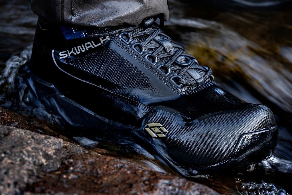 Skwala RS fly fishing wading boot close-up in moving water showing durable TPU reinforced upper