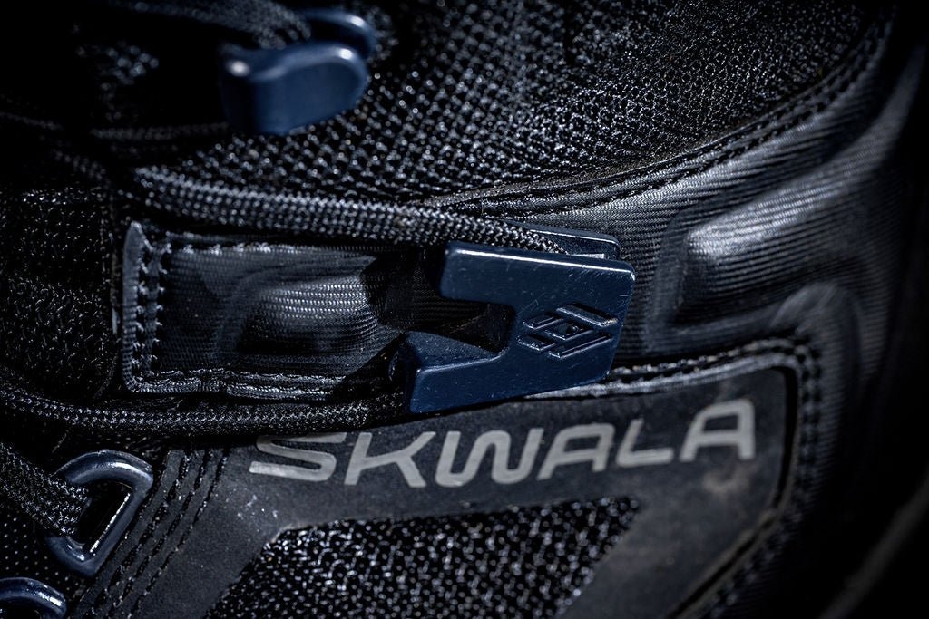 Close-up of Skwala RS wading boot glass-impregnated D-ring lacing system and durable upper materials