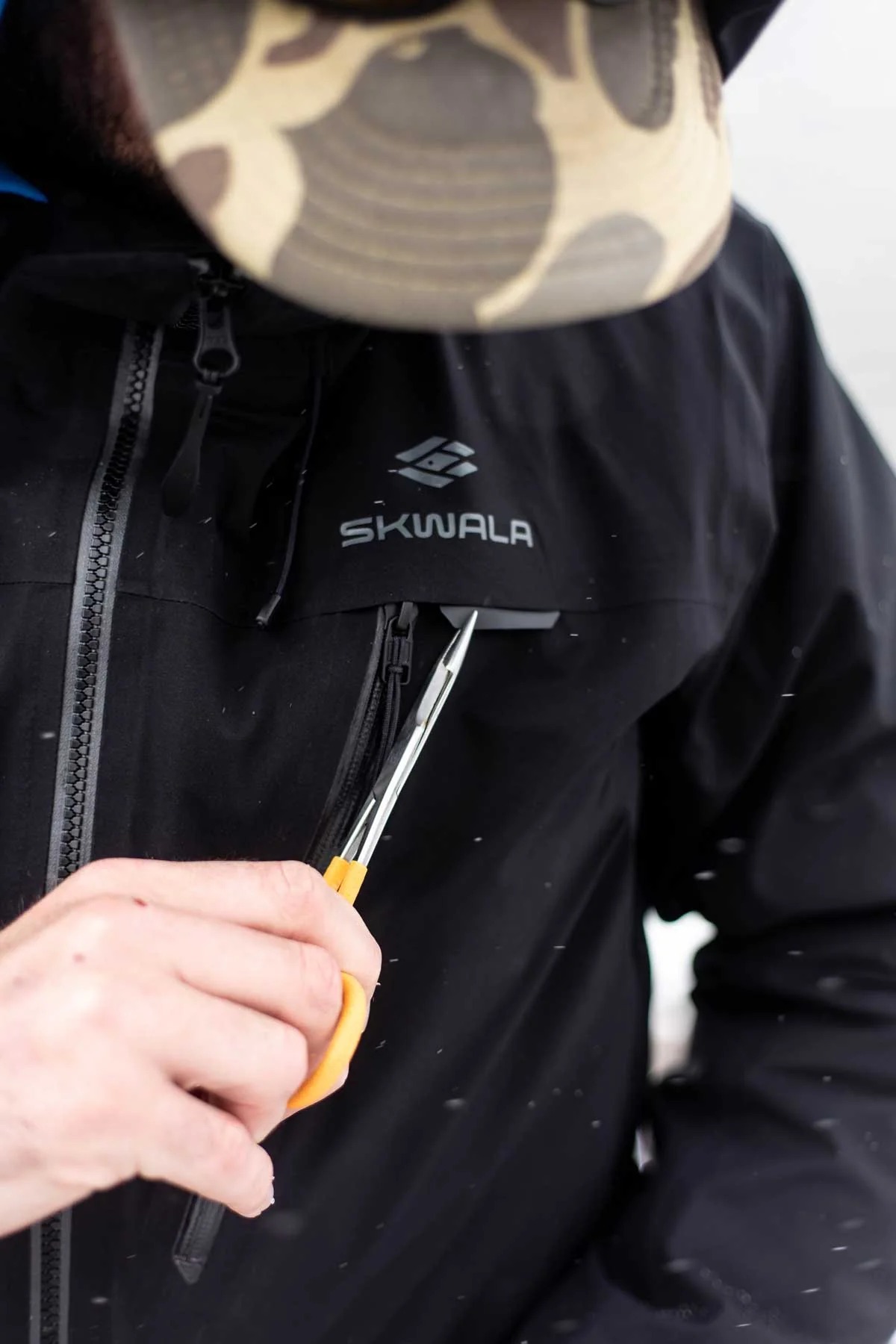 Skwala RS Outpost insulated waterproof fly fishing jacket with chest forcep holder for quick tool access