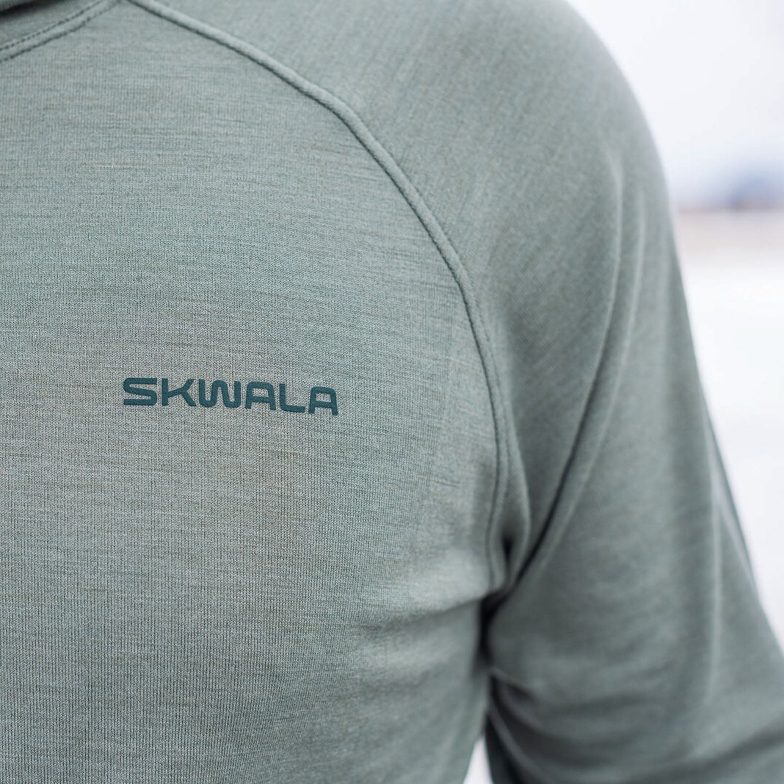 Skwala Thermo 150 Hoody ultrafine Merino wool fly fishing shirt close-up logo detail