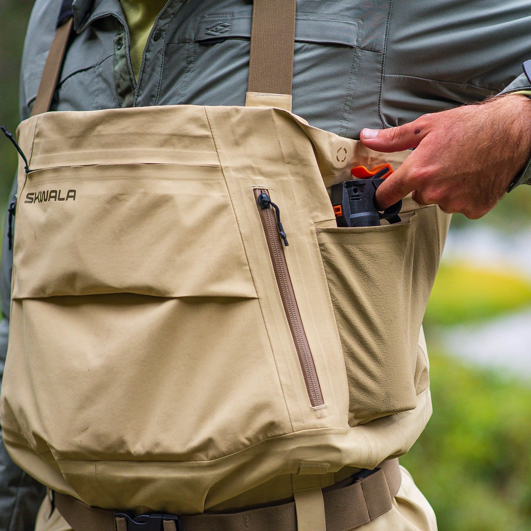 Skwala Backeddy Waders side dump pocket for quick access to tippet, floatant, and fishing tools