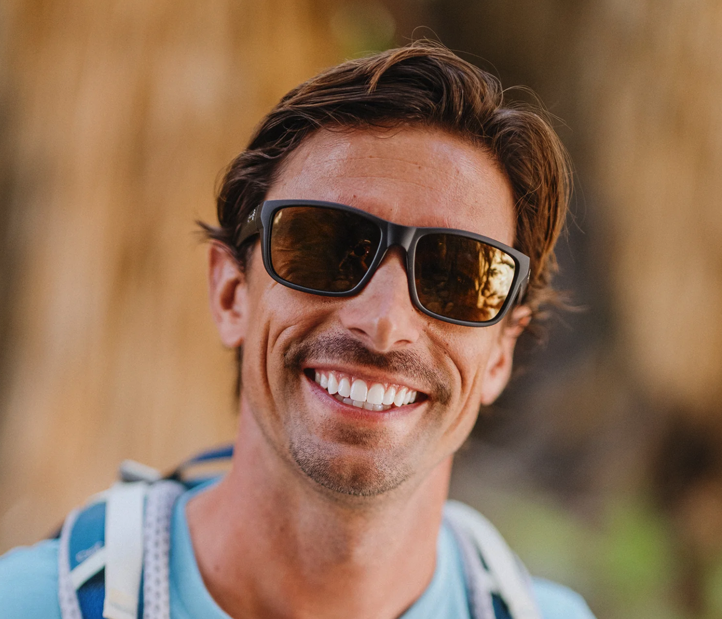 Front on view of man wearing Suncloud Mayor Polarized Sunglasses Matte Black Sienna Mirror