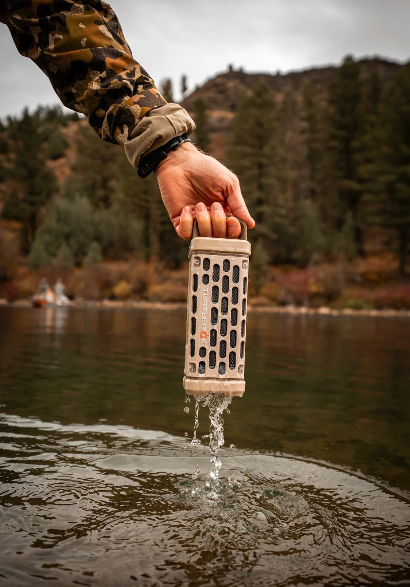 Turtlebox Ranger Speaker being pulled from water.