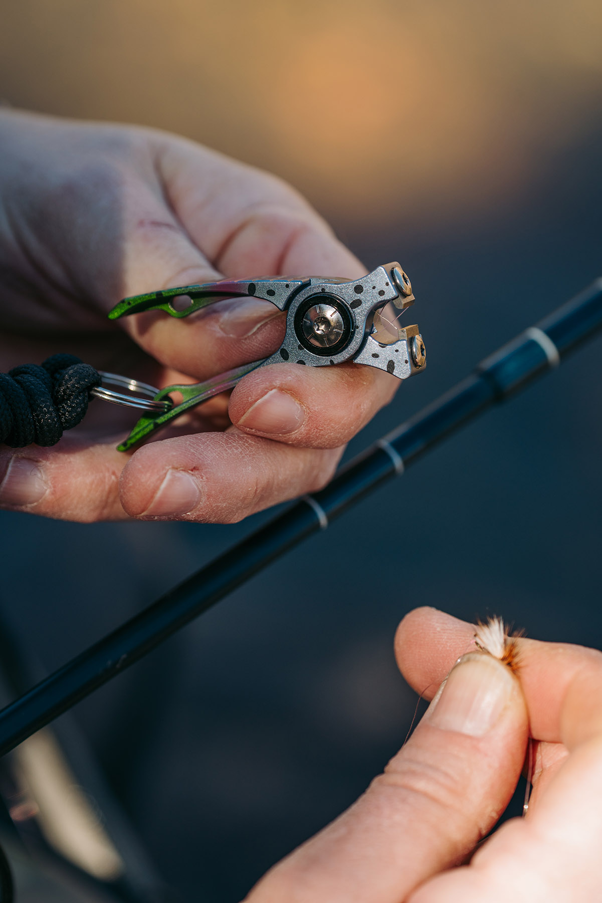 Umpqua RiverRun rainbow trout nippers attached to fishing pack retractable zinger fly fishing tool setup