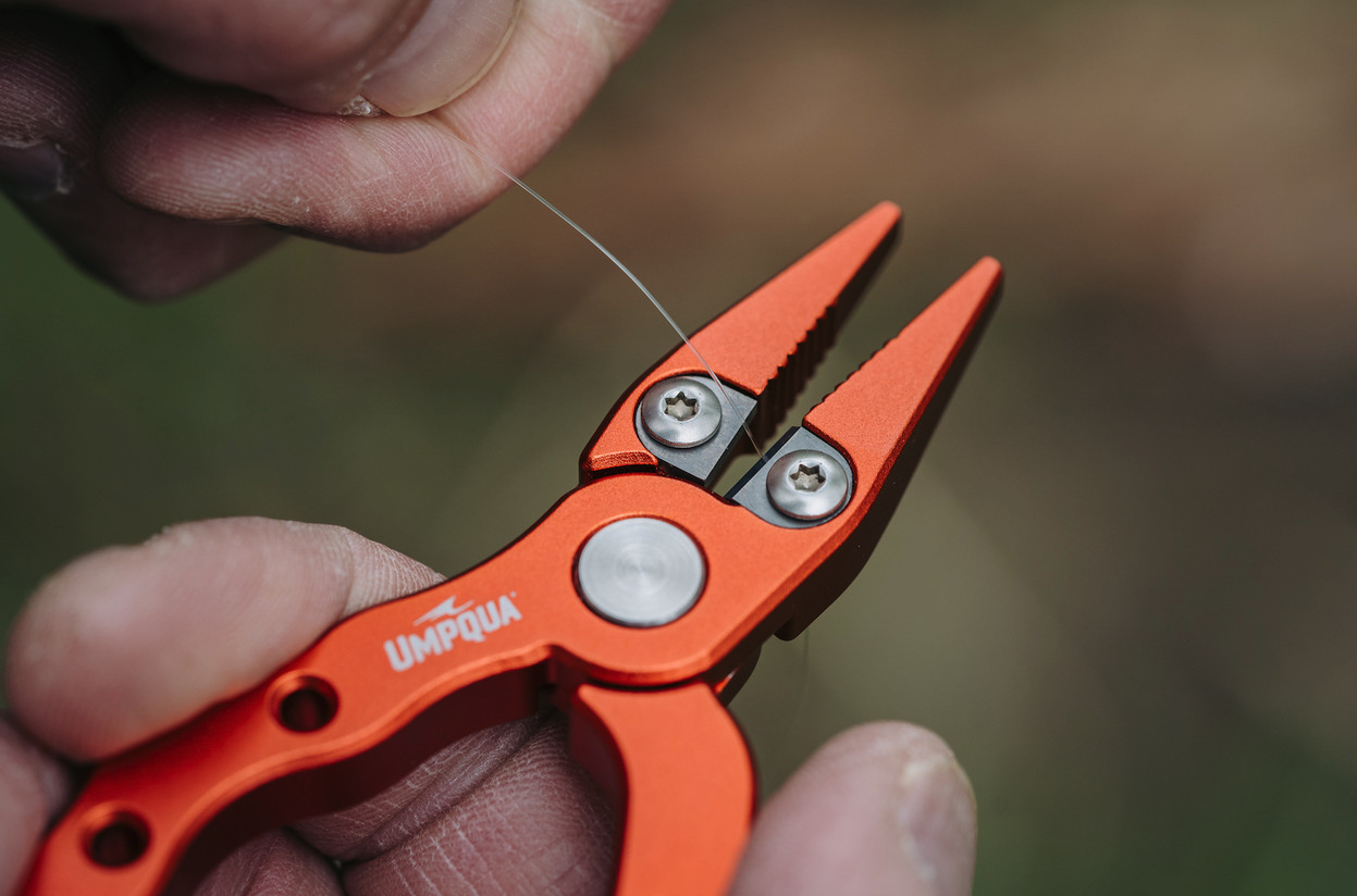 Durable Umpqua RiverRun Trout Pliers featuring ergonomic grip for comfortable use.