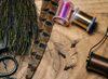 Table of fly tying material with Umpqua XC260BL-BN Nymph Hooks