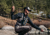 Angler landing fish wearing Umpqua NorthFork Small Chest