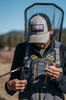 Angler tying line while wearing Umpqua NorthFork Small Chest
