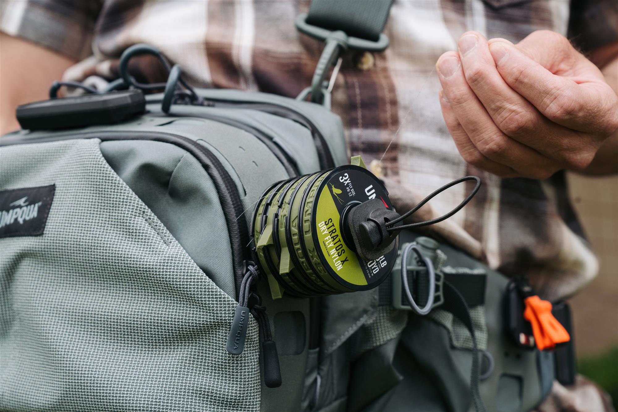 Umpqua LINK Tippet Tower mounted on fishing pack with tippet spools for quick access