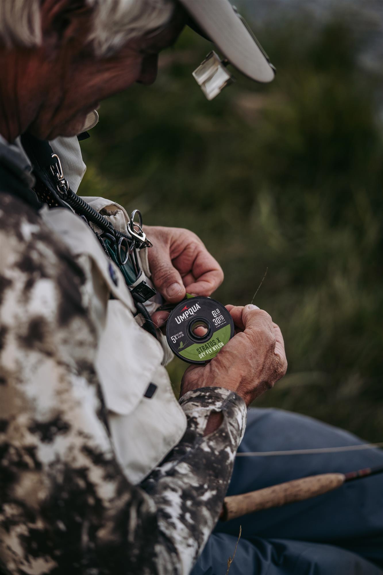 An angler using Umpqua Stratos X Dry Fly Tippet