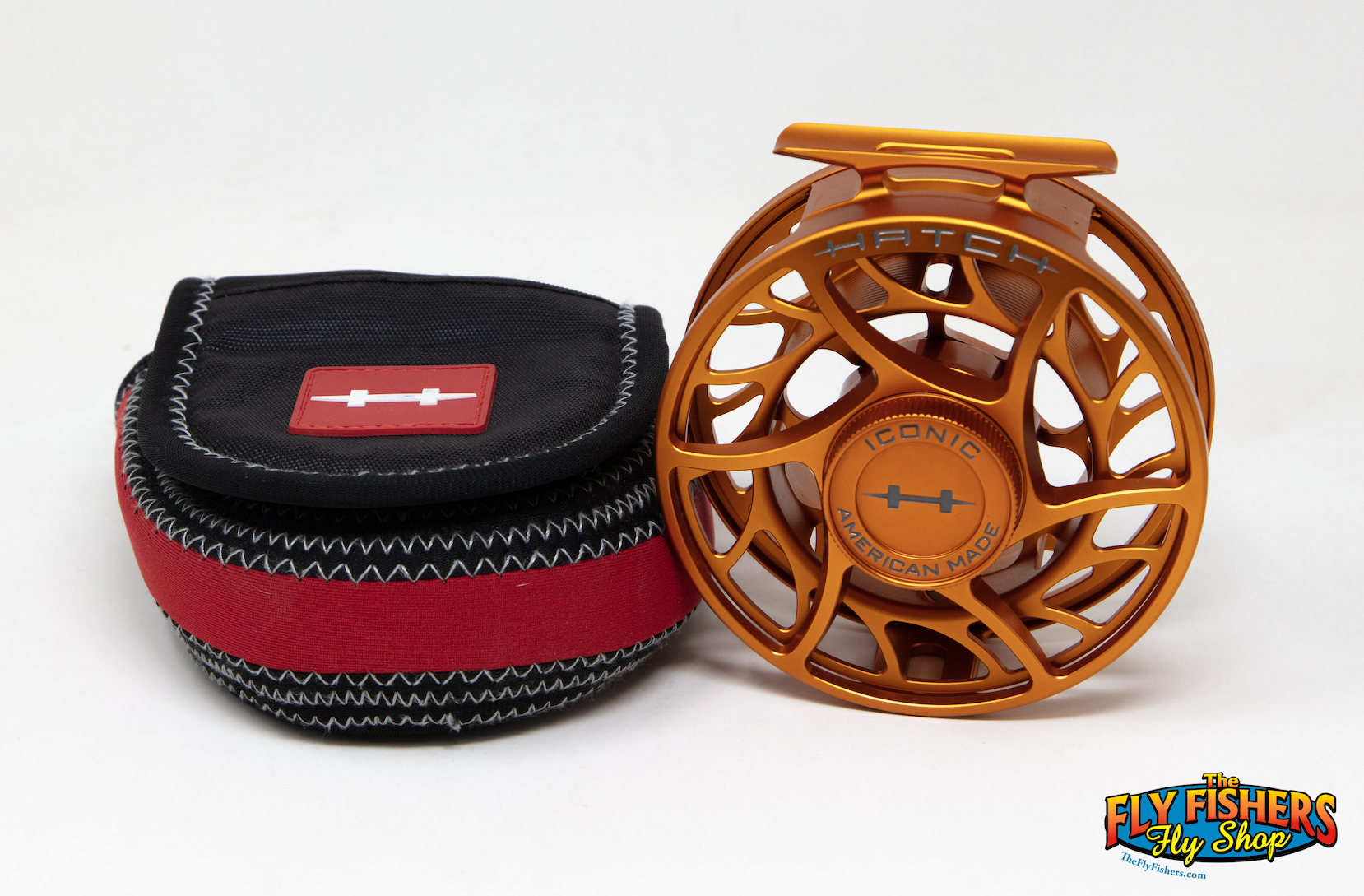 Used Hatch Iconic 7+ Large Arbor Campfire Orange Fly Reel with reel pouch.