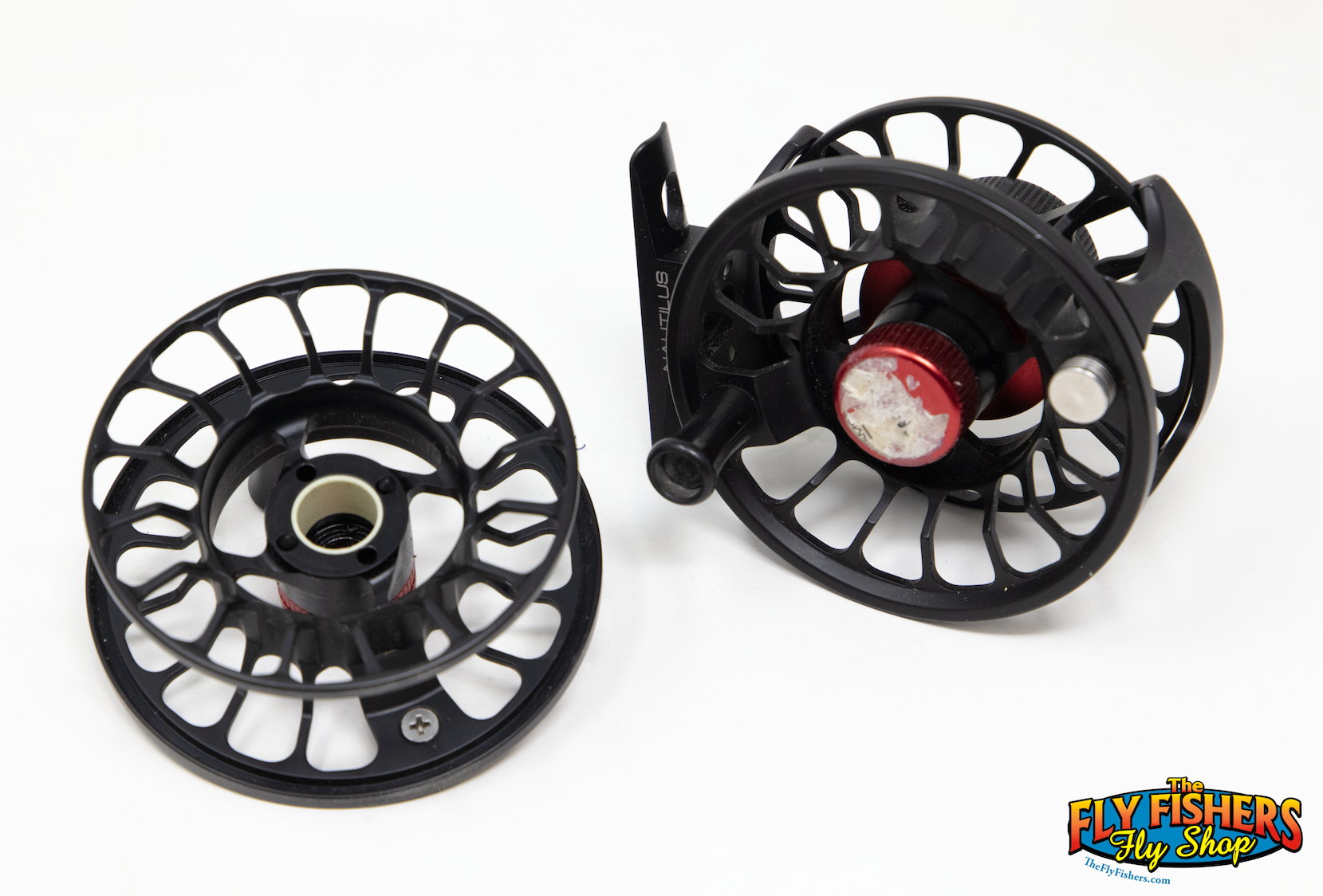 Back sides of Used Nautilus XS Black Fly Reel & Spool