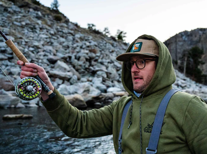Angler fishing while wearing Yakoda Catch & Release Corduroy Hat