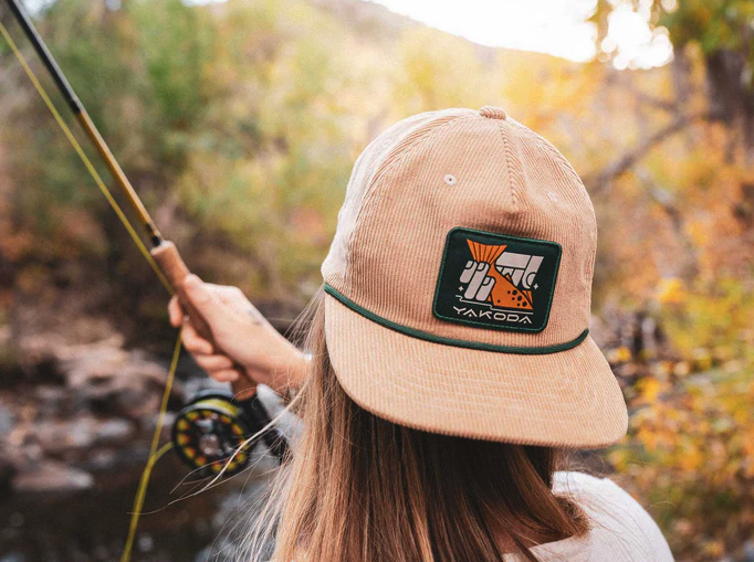 Angler wearing backwards Yakoda Catch & Release Corduroy Hat while fishing