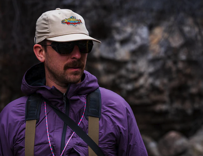 Angler wearing Yakoda Mosaic Trout Hat and sunglasses