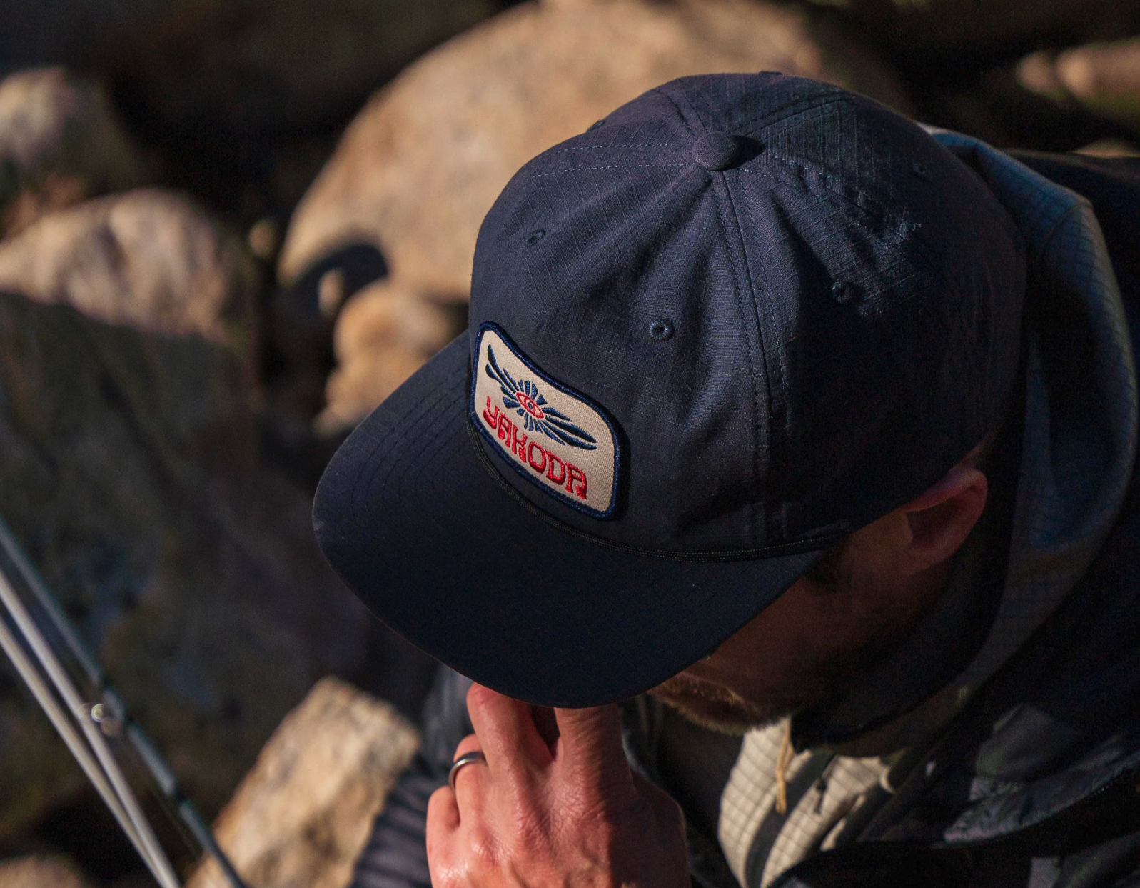 Yakoda Mystic Trout Hat on angler's head.