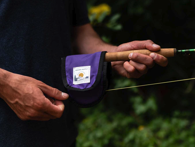 Protective Yakoda reel cover for fly fishing adventures.
