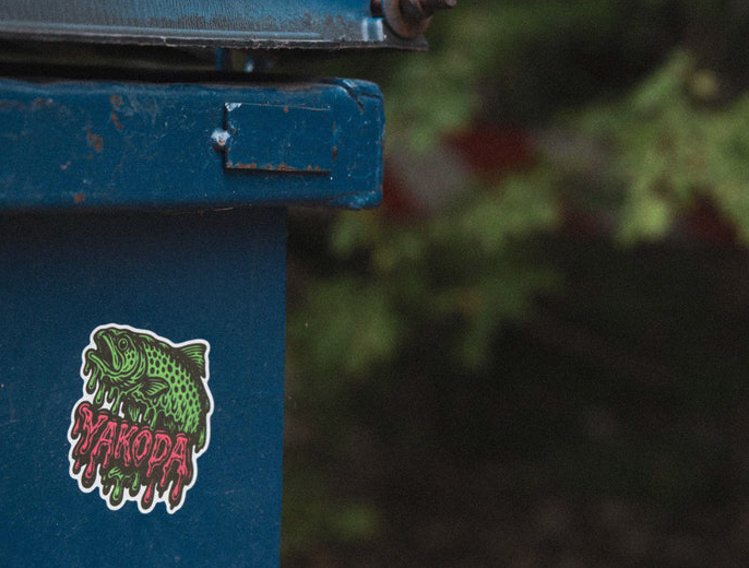 Yakoda Drippy Trout Sticker On Garbage Can