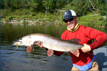 Jared catching northern pike while fly fishing